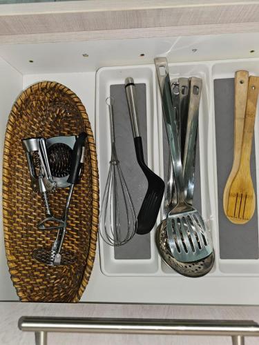 a drawer filled with utensils in a kitchen at Déjàvu at the Bay in Richards Bay