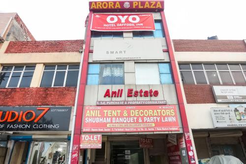 a building with signs on the side of it at OYO Flagship New Daffodil Inn in Ballabgarh