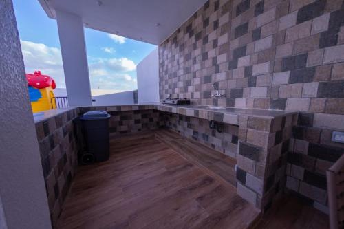 a bathroom with a sink and a trash can at بهجة الجبل الأخضر in Ḩayl Yaman