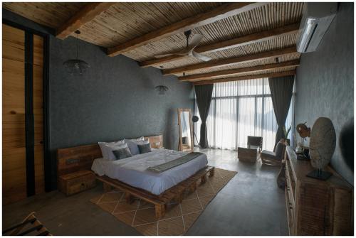 a bedroom with a large bed in a room at Casa Concreto-Infinite Luxury in Jodhpur