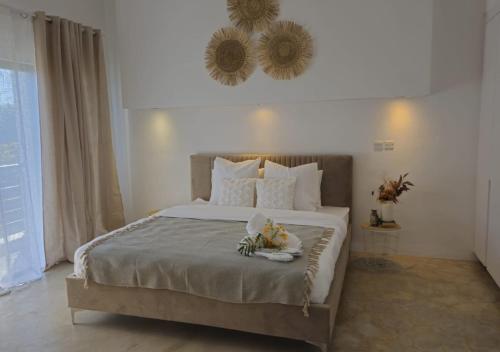 a bedroom with a large bed with flowers on it at Modern Villa in Grand Bay - Short Walk to Beach in Grand-Baie
