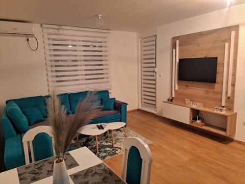 Μια τηλεόραση ή/και κέντρο ψυχαγωγίας στο Cozy Apartment