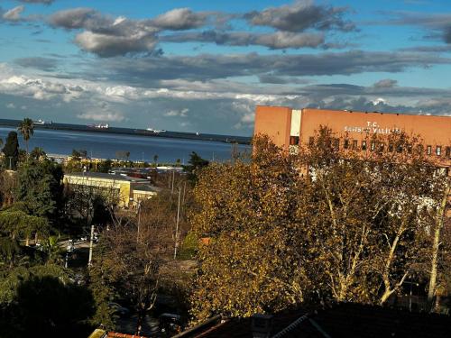 a large building next to a body of water at Samsun Park Hotel in Samsun