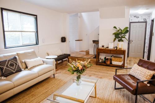 a living room with a couch and a table at SunStar Alaska Bed and Breakfast LLC in Anchorage