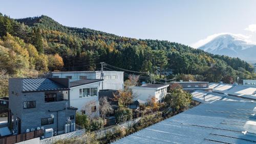 an aerial view of a city with a mountain at SWEET VILLA TAKASAMA 2 in Fujiyoshida