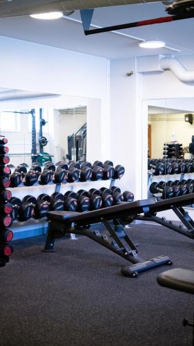 a gym with a rack of dumbbells at Medlefors Hotell & Konferens in Skellefteå