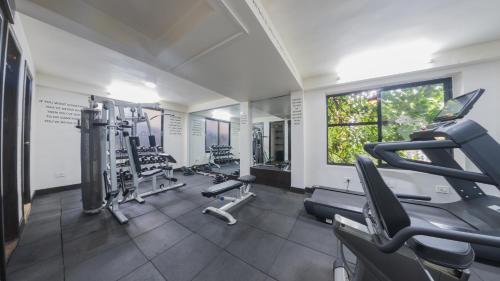 a gym with treadmills and cardio equipment in a room at Dalai-La Boutique Hotel in Kathmandu