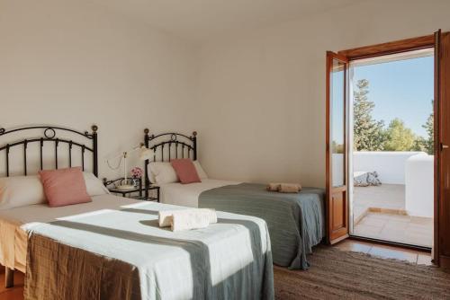 A bed or beds in a room at Can Rei Ibiza
