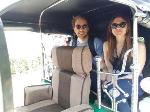a man and a woman sitting in the back of a car at Himawari Hills in Nuwara Eliya