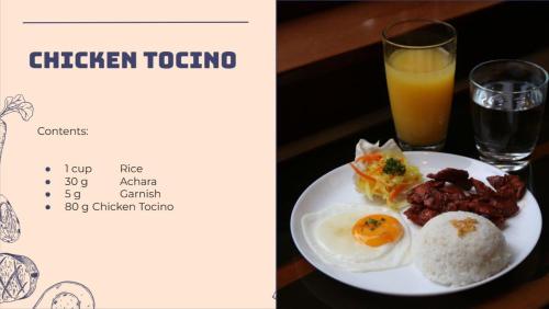 a plate of eggs and rice and a glass of orange juice at City Pod Hotel in Cebu City