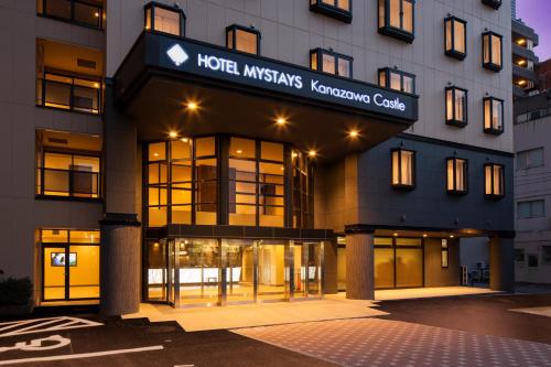 a hotel with a sign on the front of a building at HOTEL MYSTAYS Kanazawa Castle in Kanazawa