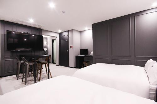 Кровать или кровати в номере XYM Hotel Mundeok