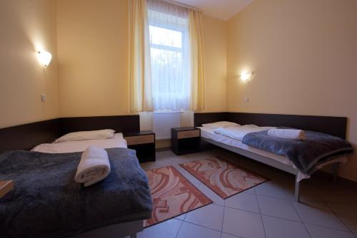 Postel nebo postele na pokoji v ubytování Hotel Miramar
