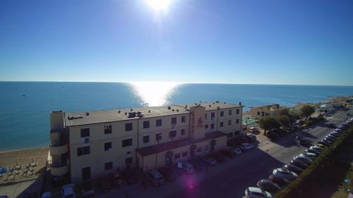 an aerial view of a building next to the ocean at Hotel Brigantino Non Dista in Porto Recanati
