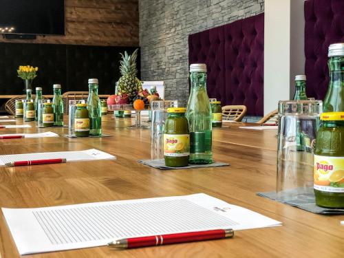 a long table with bottles of alcohol on it at Boutique Aparthotel Chalets Coburg in Schladming