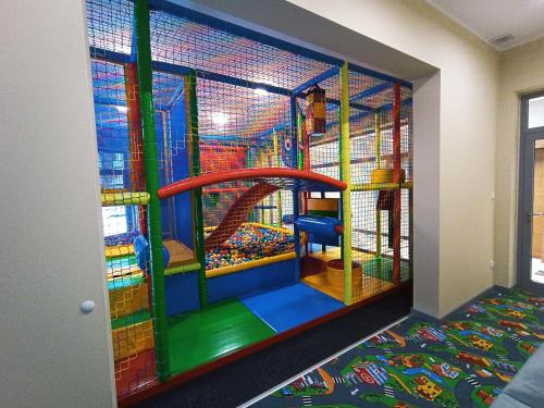 a childrens play room with a large play structure at Apartamenty Cypel Helski in Hel