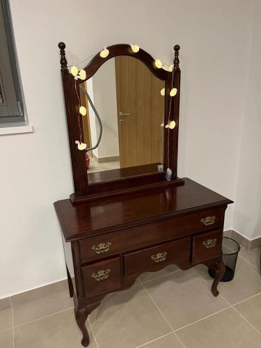 a wooden dresser with a mirror on top of it at Antemurale - Luxury rooms,Plitvice Lakes in Rastovača