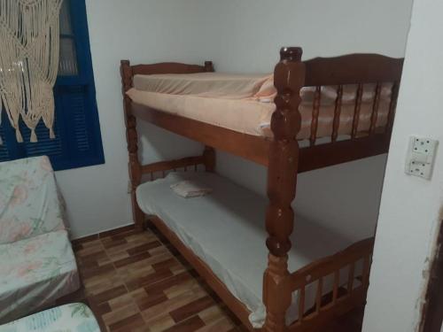 a pair of bunk beds in a room at Chácara Rancho da Felicidade in Mogi das Cruzes