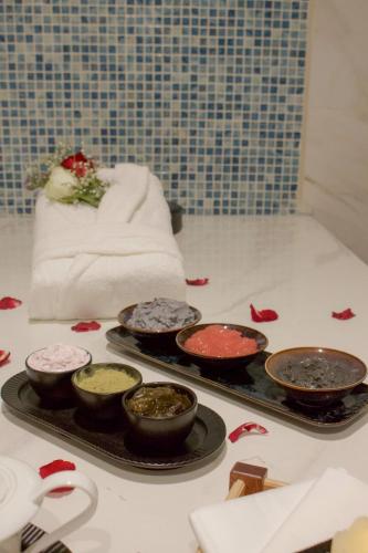 a tray filled with different colored paints on a counter at Best Western Plus Danat Almansak Hotel in Abha