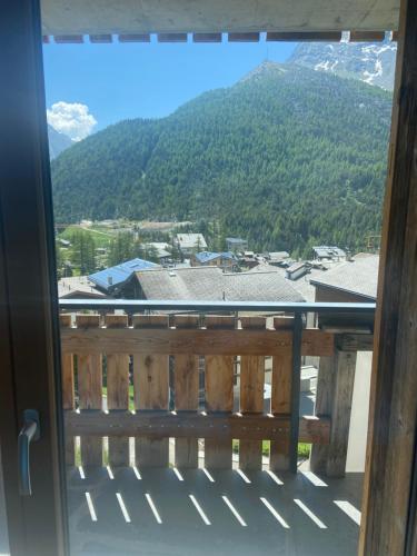 a balcony with a view of a mountain at Boutique Lodge Spycher in Saas-Fee