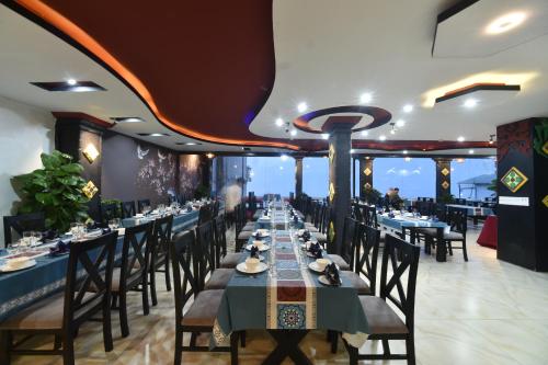 a dining room with long tables and chairs at Sapa Nature View Hotel in Sa Pa