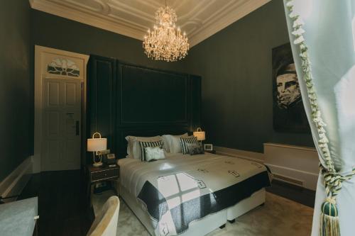 Postel nebo postele na pokoji v ubytování Torel Palace Porto