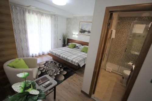 a small room with a bed and a bathroom at Apartment Silvia in Fjesa