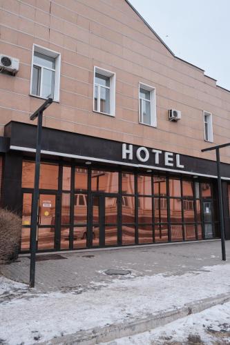 a building with a hotel written on the front of it at Hotel Europa in Semey