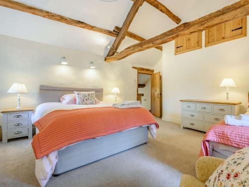 a bedroom with a large bed and two dressers at 4 Bed in Routenbeck SZ405 in Bassenthwaite Lake