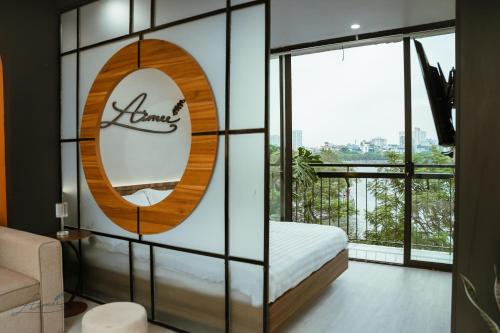 Una cama o camas en una habitación de AimeeHouse - Trích Sài