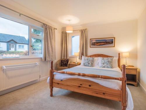 a bedroom with a bed and a large window at 3 Bed in Thornthwaite SZ194 in Braithwaite
