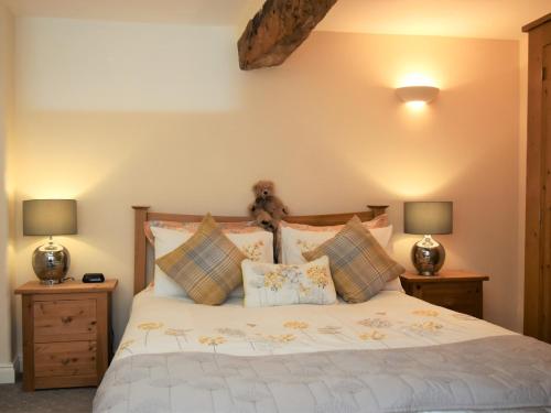 a bedroom with a bed with two night stands at 2 Bed in Patterdale SZ470 in Patterdale