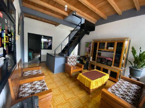 an overhead view of a living room with furniture at Krui Saejadi Surf and Stay in Krui