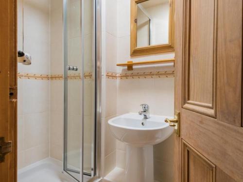 a bathroom with a sink and a glass shower at 3 Bed in Water Yeat SZ079 in High Nibthwaite