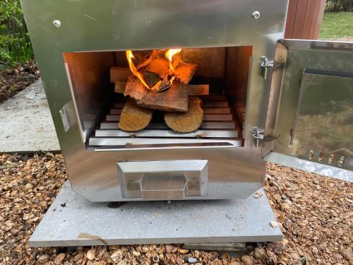a oven with two loaves of bread in it at Place 2 Beach Next to Ijsselmeer in Lemmer