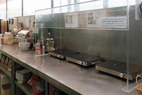 a kitchen counter with two trays on top of it at Snowflower Guesthouse in Seoul
