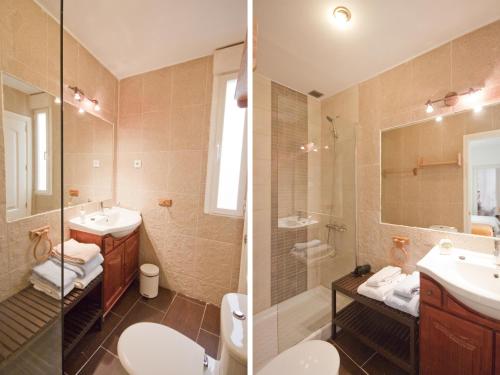 La salle de bains est pourvue de toilettes, d'un lavabo et d'une douche. dans l'établissement Enorme y acogedor piso en la puerta del sol, à Madrid