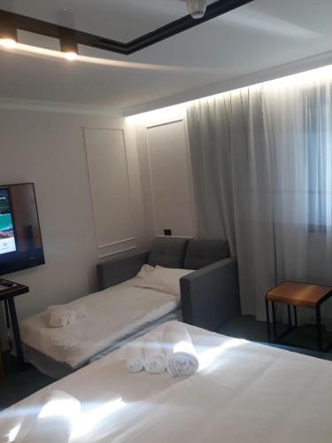 Postel nebo postele na pokoji v ubytování Hotel Celis