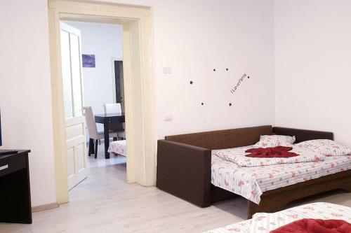 En eller flere senge i et værelse på Holiday Cazare Brasov