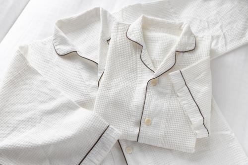 a white shirt and tie sitting on a table at Tokyu Stay Aoyama Premier in Tokyo