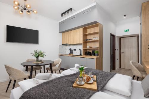 a living room with a white couch and a table at Molo Longo - Downtown Apartments in Rijeka