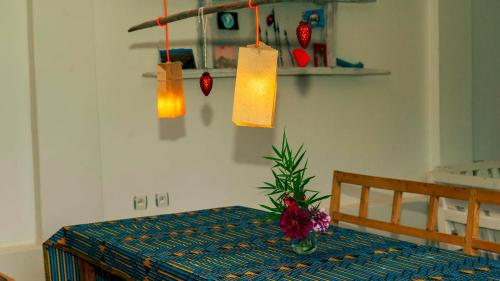 a room with a table with some lights on it at Isange Paradise Resort in Ruhengeri