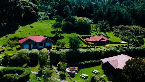an aerial view of a house on a hill at Swiss Farm Cottage in Lushoto