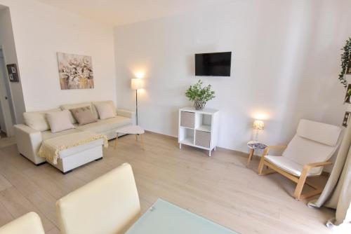 Μια τηλεόραση ή/και κέντρο ψυχαγωγίας στο Apartamentos Gran Vía by SIERRA VIVA