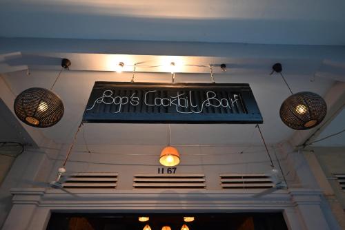 a sign hanging from the ceiling of a restaurant at Khmer Cozy in Battambang