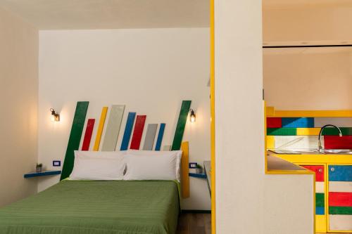 Una cama o camas en una habitación de OlbiaLoft