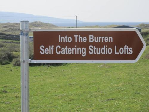 a sign that reads into the burren self catering studiooths at Into The Burren in Murroogh