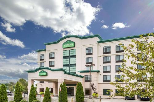 a rendering of the exterior of a hotel at Wingate by Wyndham Richmond Short Pump in Richmond