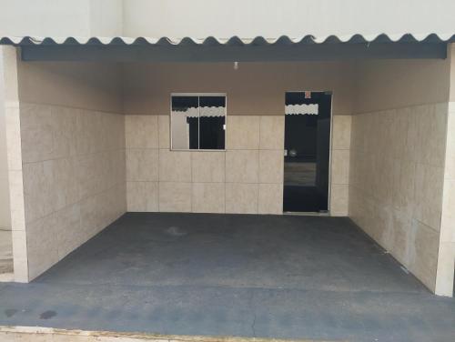 a room with two doors in a building at Pausada do Gilmar in Ribeirão