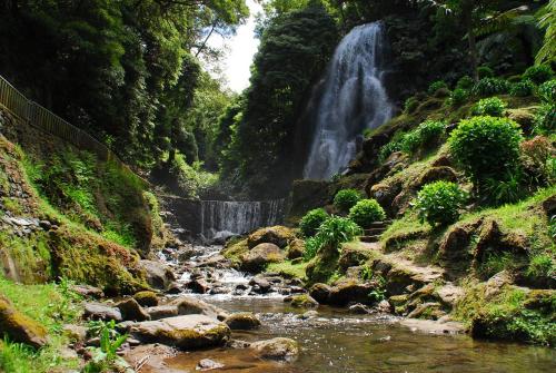 a waterfall in the middle of a river at A Toca in Nordeste
